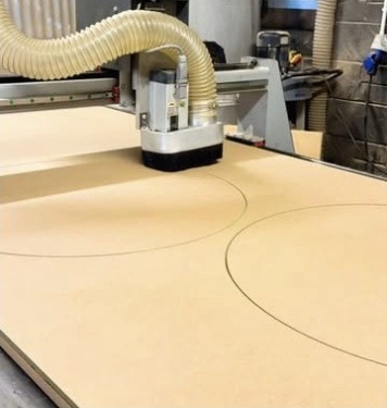 CNC routing a panel in the workshop